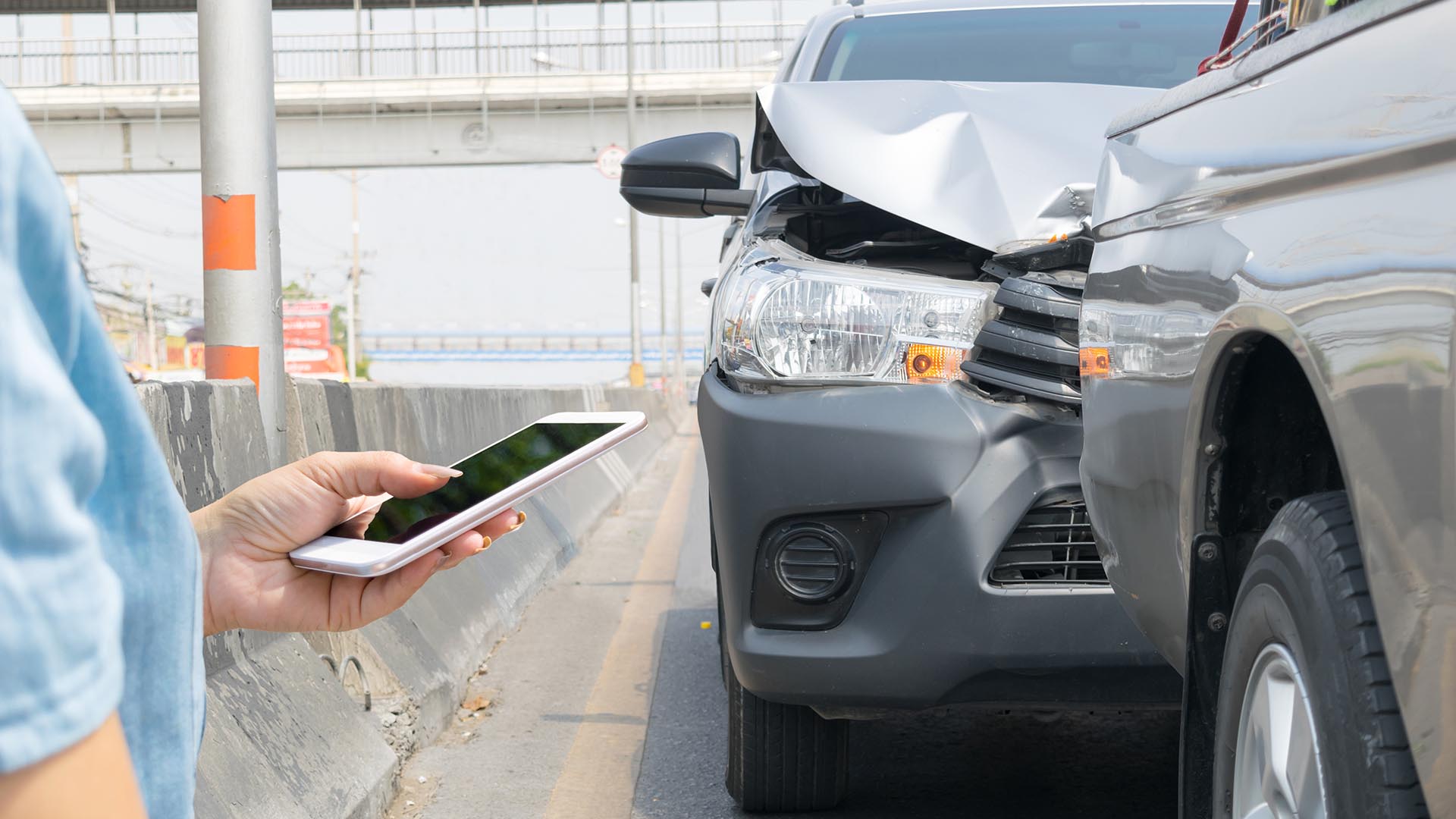 rear end accident person holding phone