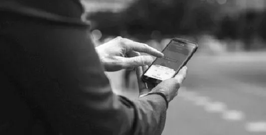 Passenger using a rideshare app inside a vehicle