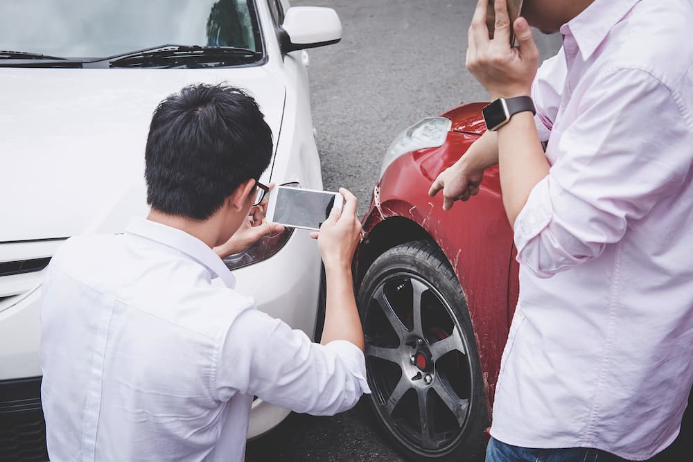 two drivers man arguing after a car traffic accident