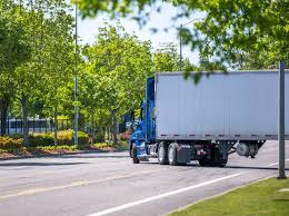 Diagram showing how large trucks make wide right turns to avoid collisions with nearby vehicles or obstacles.