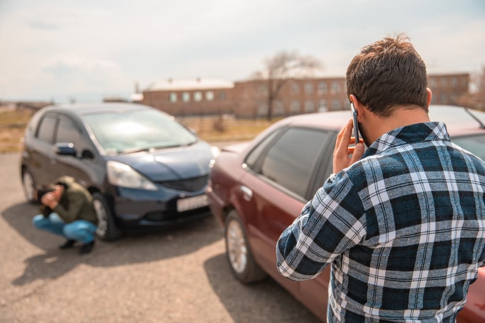 After the car accident, the driver calls the police.