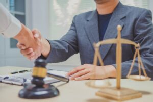 personal injury attorney shaking hand with a client