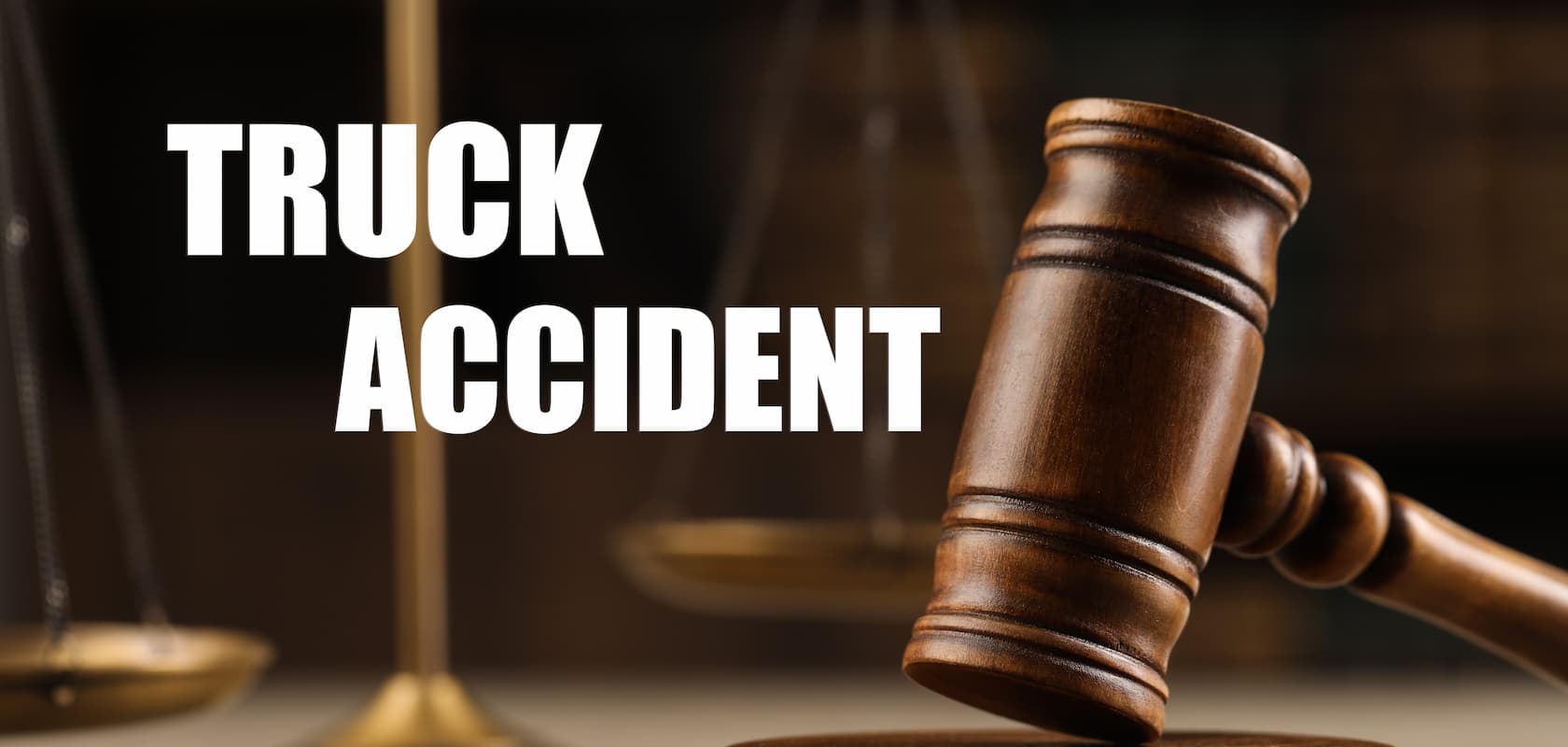 Truck accident law. Wooden judge's gavel and scales of justice on table